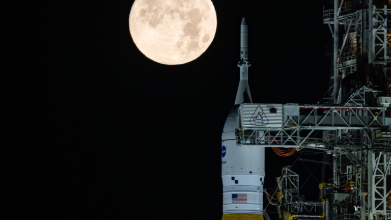 NASA’s Space Launch System and Orion at Launch Pad 39B under a full moon