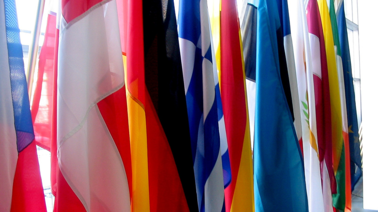EU flags in a European Commission building lobby in Brussels
