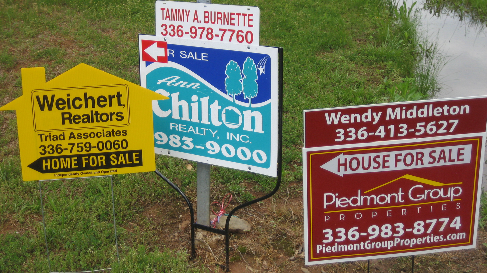 For sale signs outside homes